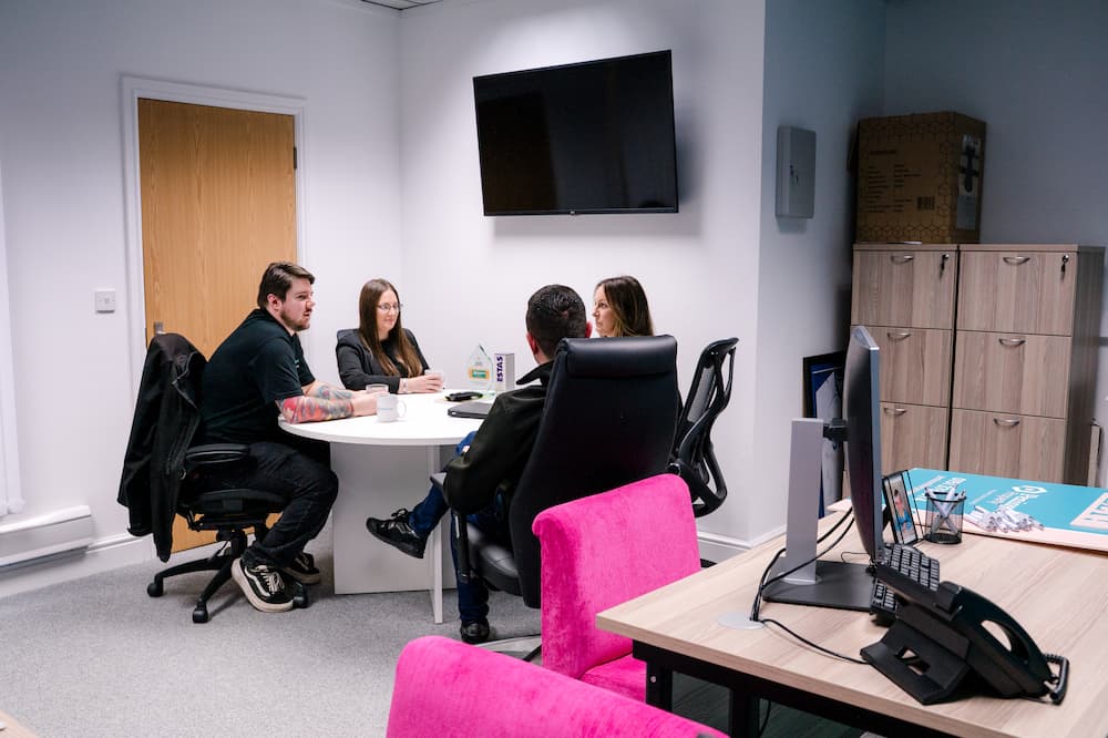 members of a property management company sat talking